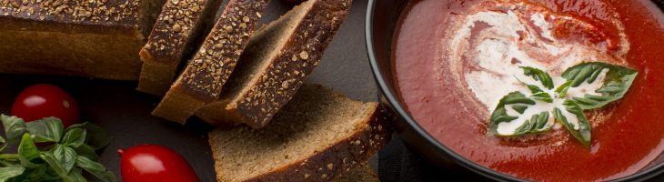 high-angle-bowl-with-winter-tomato-soup-toast